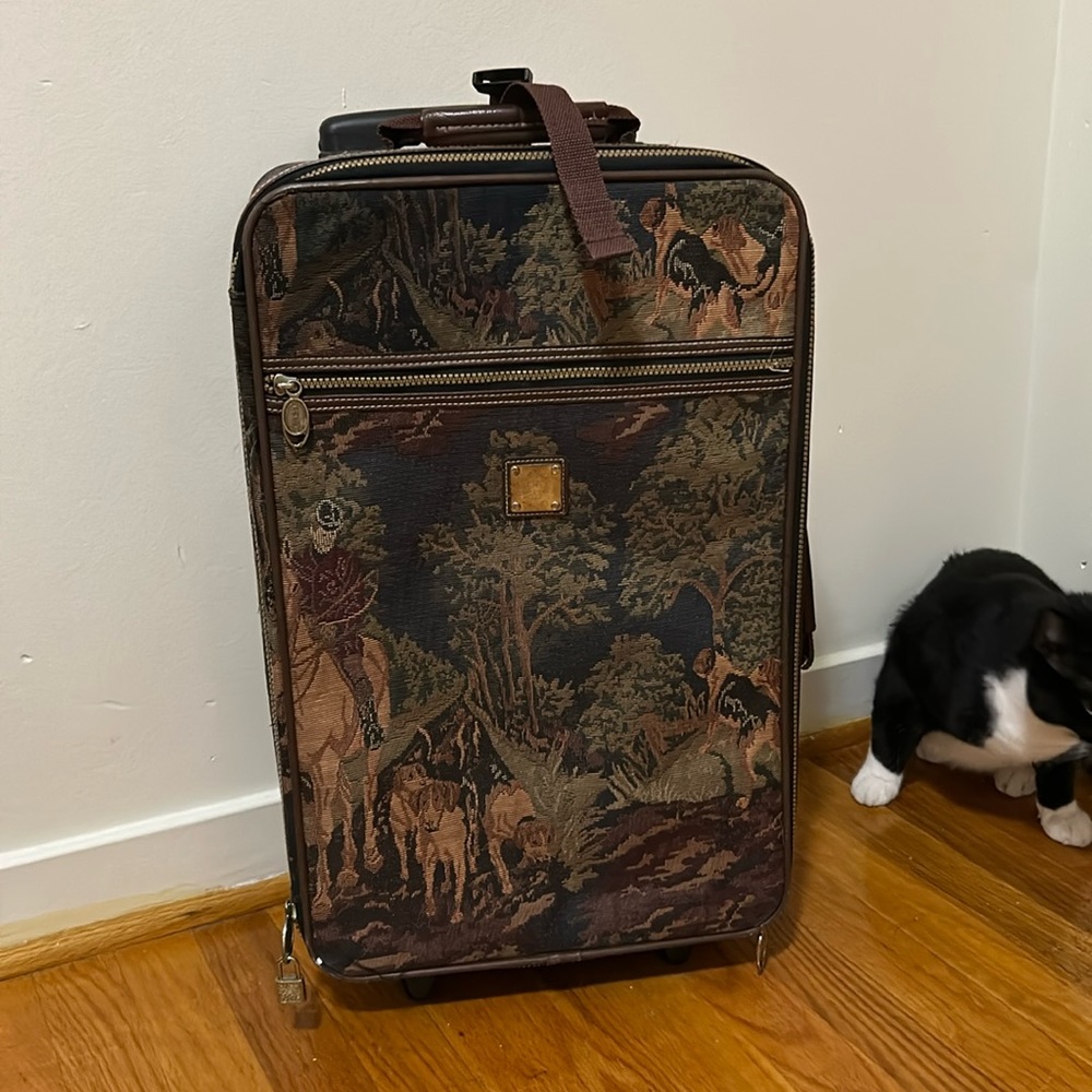 Suitcase with hounds on it